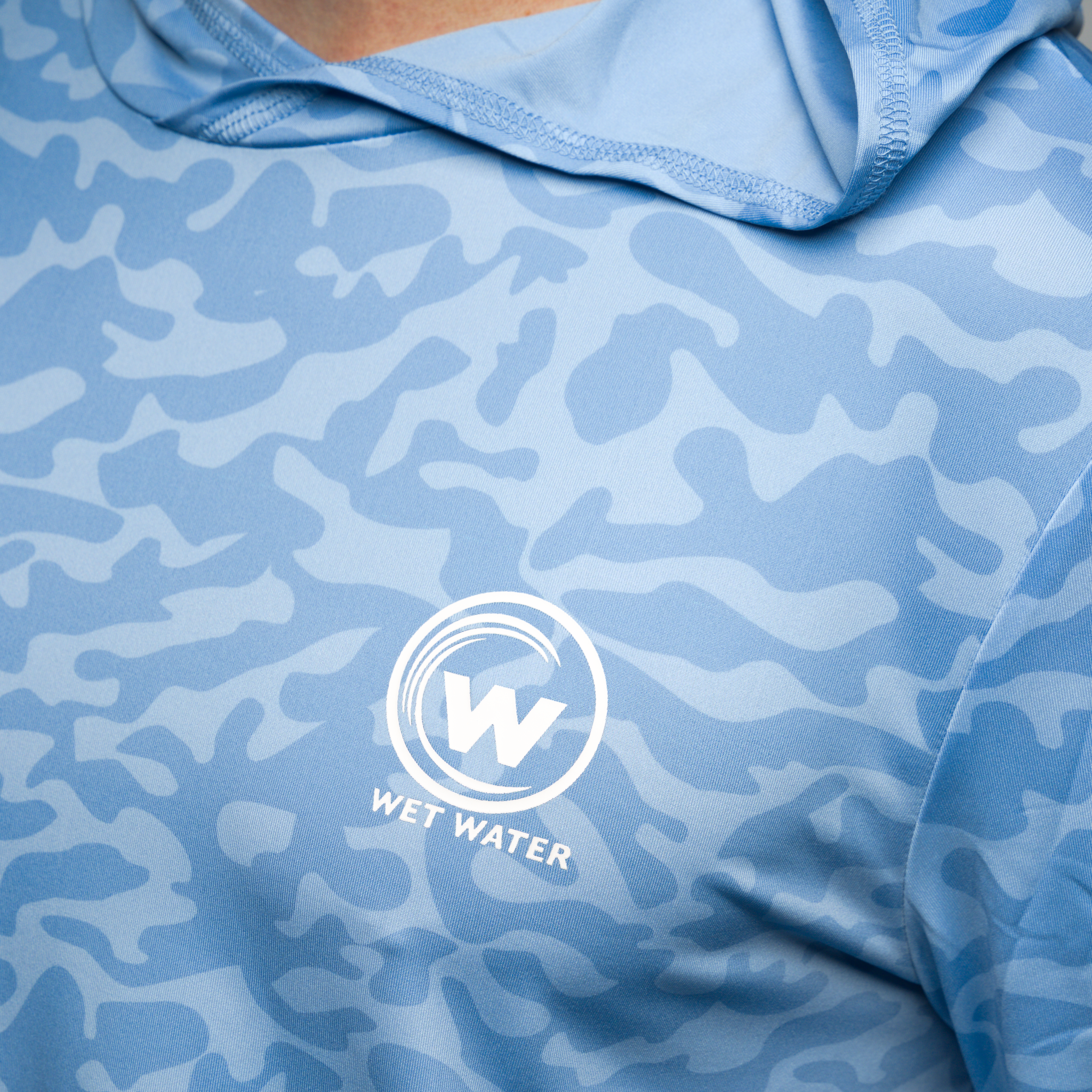 Wet Water Drift Current Performance Hoodie in blue — chest logo detail